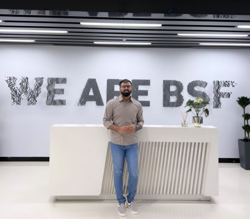 First day at Banque Saudi Fransi, in front of the “We are BSF” wall